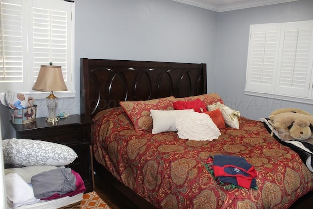 bedroom with ornamental molding