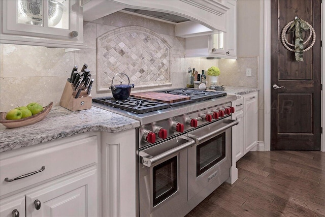 5708 Barrington Ct, Amarillo, TX 79119 - kitchen featuring white cabinetry, backsplash, double oven range, and premium range hood