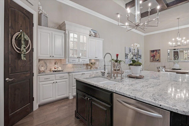 5708 Barrington Ct, Amarillo, TX 79119 - kitchen with white cabinets, a chandelier, dishwasher, a sink, and backsplash