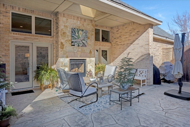 5708 Barrington Ct, Amarillo, TX 79119 - view of patio / terrace featuring grilling area and a glass covered fireplace