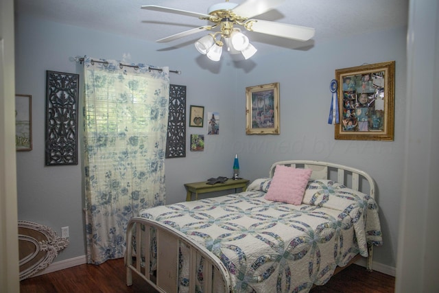 503 Maple Ave, Panhandle, TX 79068 - bedroom featuring dark wood-style flooring and a ceiling fan