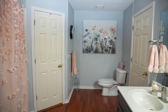 503 Maple Ave, Panhandle, TX 79068 - bathroom with vanity, wood finished floors, and a shower with shower curtain