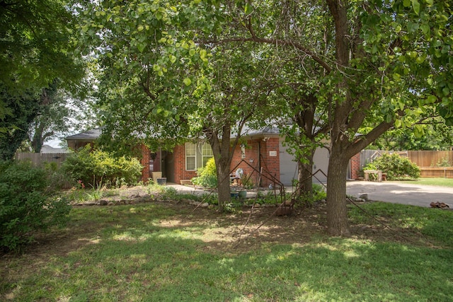503 Maple Ave, Panhandle, TX 79068 - view of front of home with brick siding, driveway, and a garage