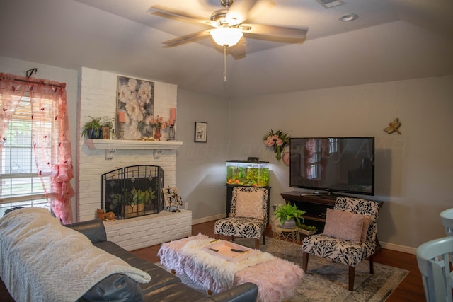 503 Maple Ave, Panhandle, TX 79068 - living area with wood finished floors, ceiling fan, lofted ceiling, and a brick fireplace