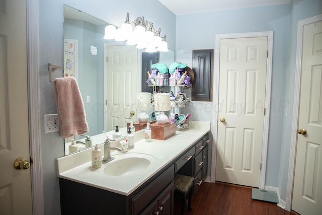 503 Maple Ave, Panhandle, TX 79068 - bathroom with wood finished floors and vanity