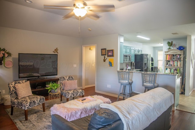 503 Maple Ave, Panhandle, TX 79068 - living area featuring a ceiling fan and wood finished floors