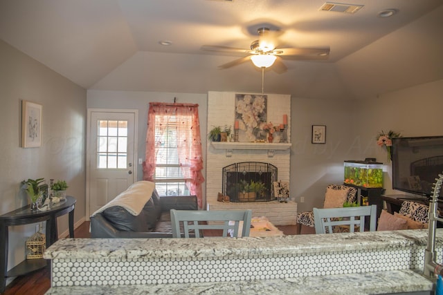 503 Maple Ave, Panhandle, TX 79068 - living room featuring lofted ceiling, wood finished floors, a ceiling fan, a brick fireplace, and recessed lighting