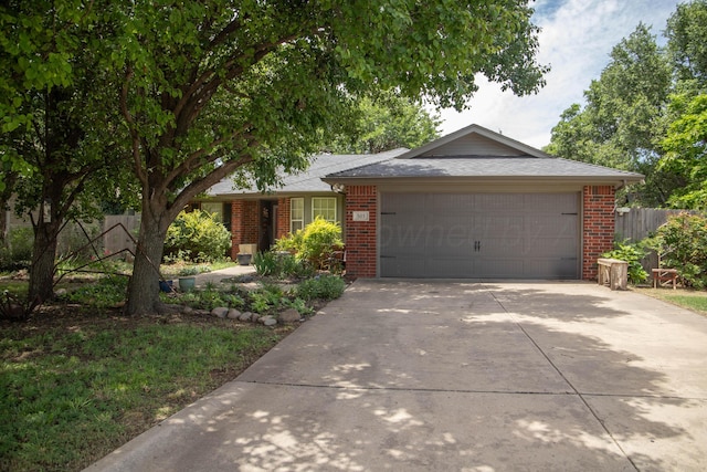 503 Maple Ave, Panhandle, TX 79068 - ranch-style home featuring brick siding, concrete driveway, and an attached garage