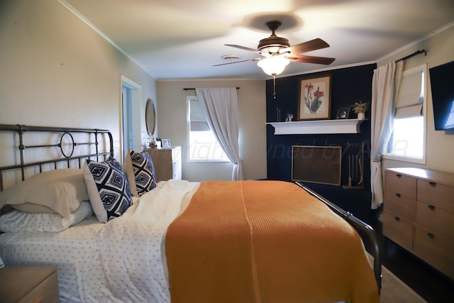 3603 S Lamar St, Amarillo, TX 79109 - bedroom with multiple windows, crown molding, and a ceiling fan