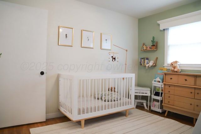 3603 S Lamar St, Amarillo, TX 79109 - bedroom with a nursery area and wood finished floors