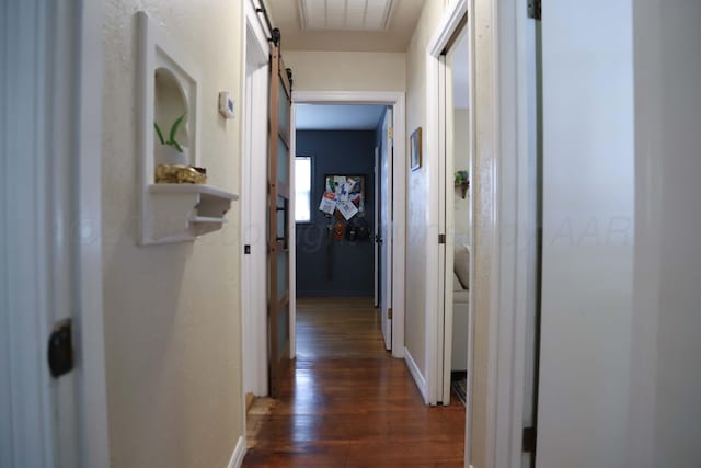 3603 S Lamar St, Amarillo, TX 79109 - hall with a barn door and dark wood-style flooring