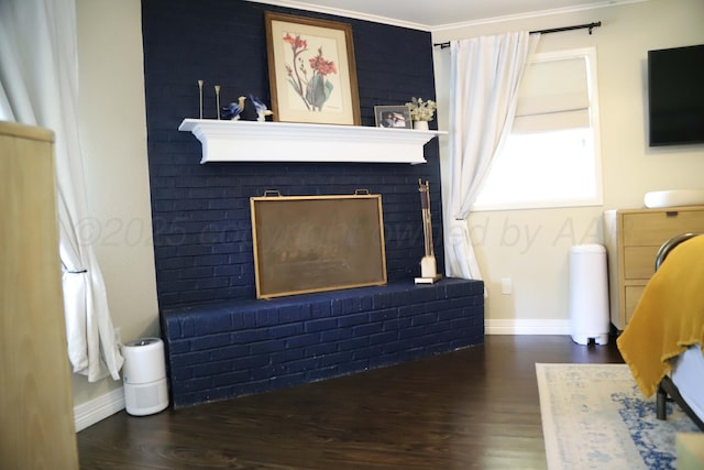 3603 S Lamar St, Amarillo, TX 79109 - living area featuring a brick fireplace, wood finished floors, and ornamental molding