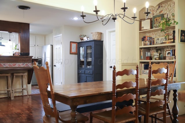 3603 S Lamar St, Amarillo, TX 79109 - dining space featuring a chandelier, dark wood-style flooring, and built in features
