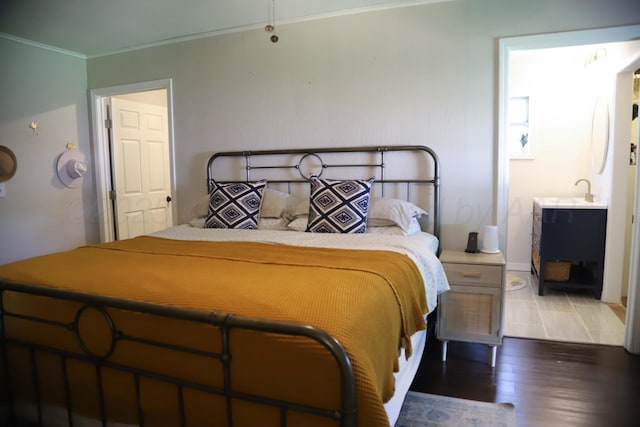 3603 S Lamar St, Amarillo, TX 79109 - bedroom featuring ornamental molding, wood finished floors, and ensuite bath
