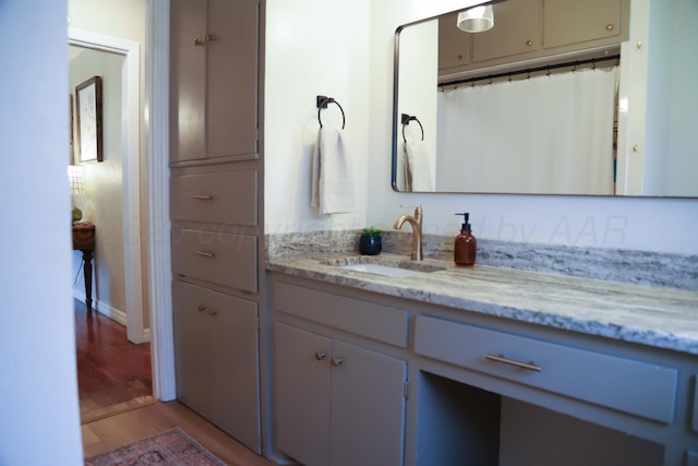 3603 S Lamar St, Amarillo, TX 79109 - full bathroom featuring vanity and wood finished floors