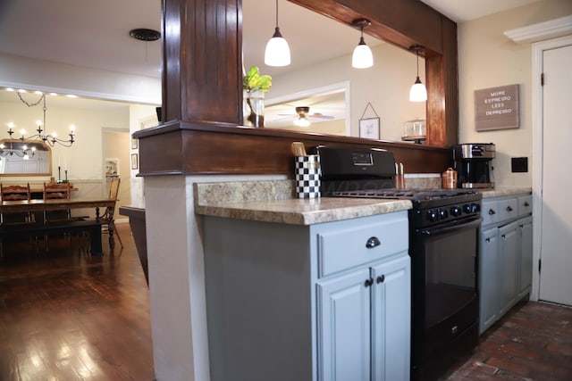 3603 S Lamar St, Amarillo, TX 79109 - kitchen featuring black gas range, ceiling fan, a chandelier, light countertops, and decorative light fixtures