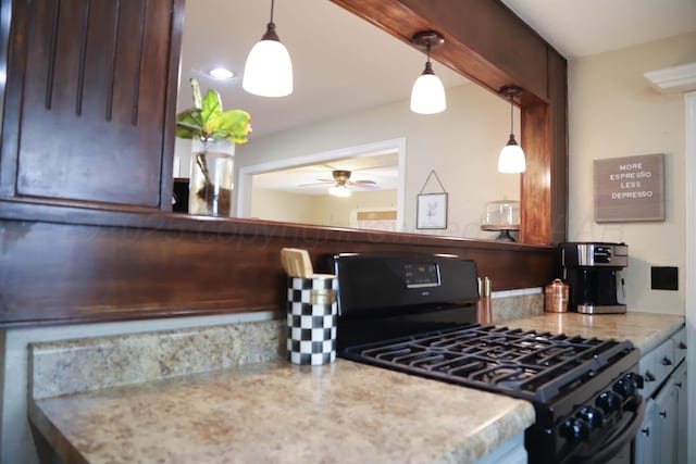 3603 S Lamar St, Amarillo, TX 79109 - kitchen featuring black range with gas cooktop, a ceiling fan, pendant lighting, and light stone countertops