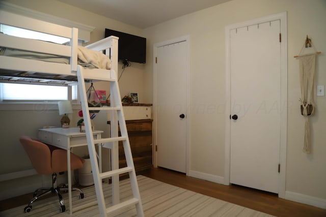 3603 S Lamar St, Amarillo, TX 79109 - bedroom with wood finished floors and an office area