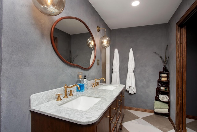 907 Broadmoor St, Amarillo, TX 79106 - full bathroom featuring double vanity and baseboards