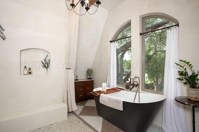 907 Broadmoor St, Amarillo, TX 79106 - full bathroom with a freestanding bath and a chandelier