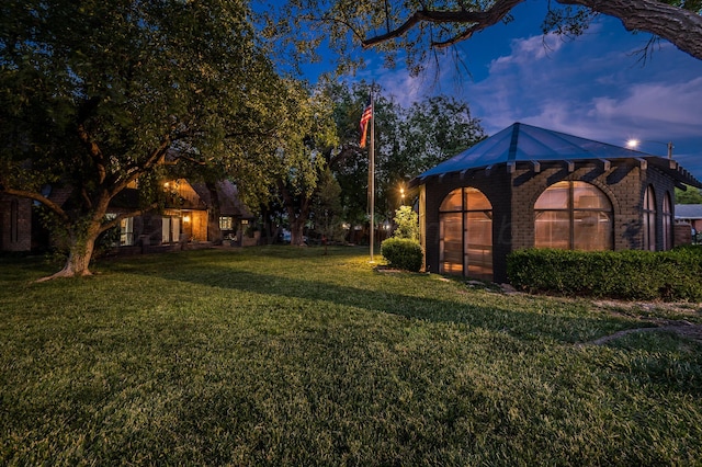 907 Broadmoor St, Amarillo, TX 79106 - view of green lawn featuring an exterior structure