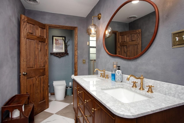 907 Broadmoor St, Amarillo, TX 79106 - bathroom with double vanity and a textured wall