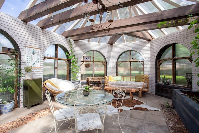 907 Broadmoor St, Amarillo, TX 79106 - sunroom with brick wall and outdoor dining area