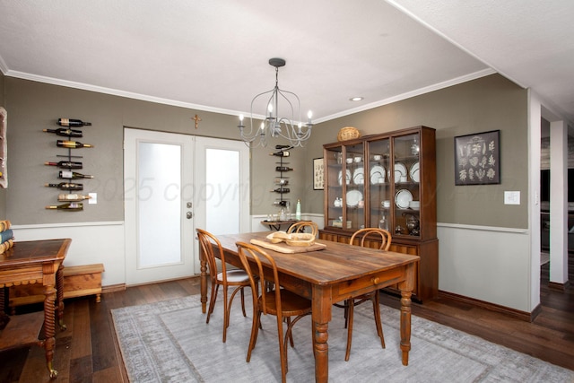 907 Broadmoor St, Amarillo, TX 79106 - dining area with wood finished floors, a chandelier, ornamental molding, wainscoting, and french doors