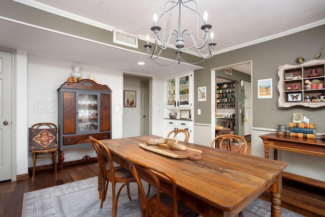 907 Broadmoor St, Amarillo, TX 79106 - dining area with a chandelier, wood finished floors, and ornamental molding