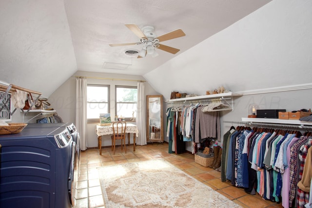 907 Broadmoor St, Amarillo, TX 79106 - walk in closet with washing machine and clothes dryer, vaulted ceiling, ceiling fan, attic access, and tile patterned floors