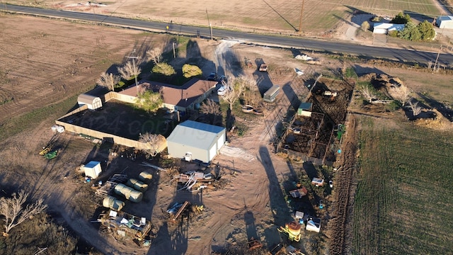 birds eye view of property with a rural view