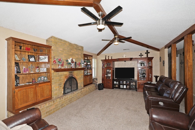 living room with vaulted ceiling with beams, ceiling fan, light carpet, and a fireplace