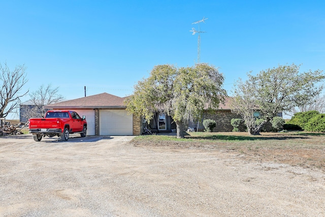 single story home with a garage