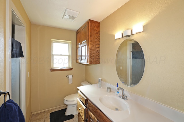 bathroom with tile patterned floors, vanity, and toilet