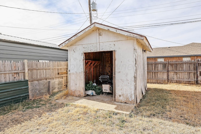 view of shed featuring a fenced backyard