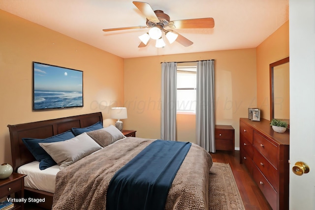 bedroom featuring dark wood-style floors and a ceiling fan
