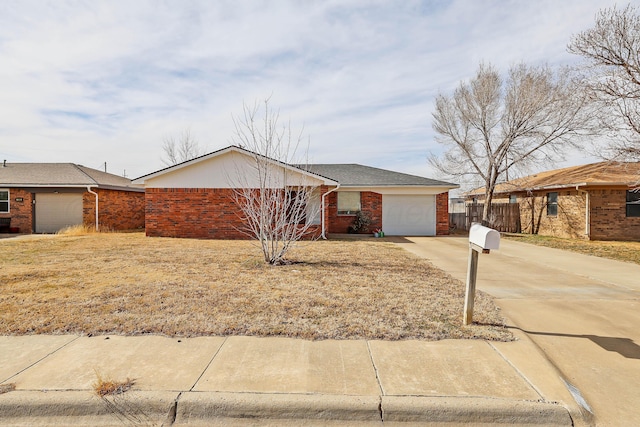 ranch-style house with fence, an attached garage, brick siding, and concrete driveway