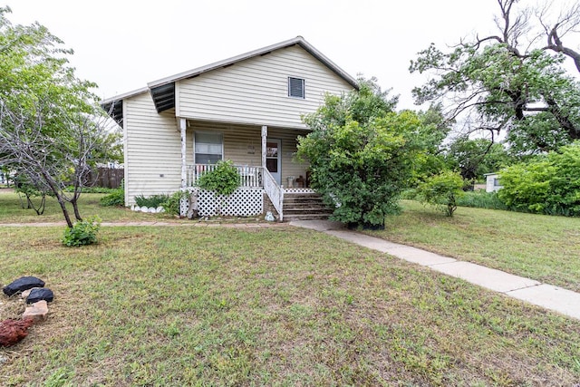 1010 E 3rd St, Clarendon, TX 79226 - view of front of home with covered porch and a front lawn