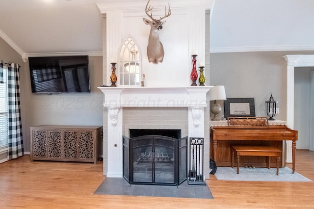 8201 Prosper Dr, Amarillo, TX 79119 - living room featuring wood finished floors, crown molding, and a fireplace