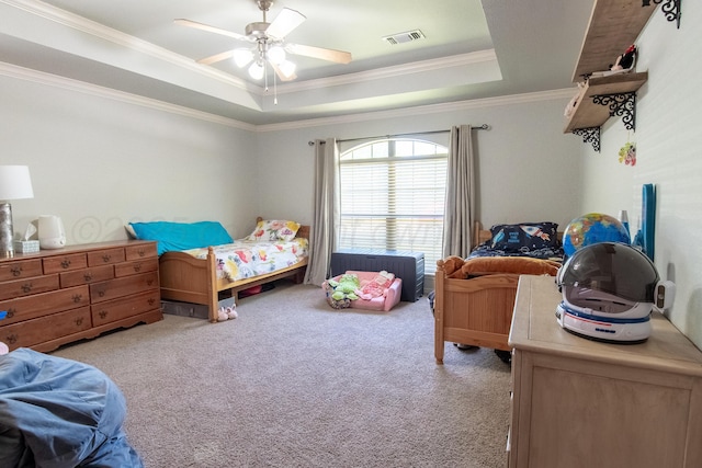 8201 Prosper Dr, Amarillo, TX 79119 - bedroom featuring light colored carpet, a tray ceiling, crown molding, and ceiling fan