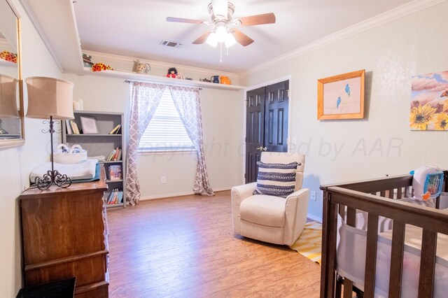 8201 Prosper Dr, Amarillo, TX 79119 - bedroom featuring wood finished floors, ornamental molding, baseboards, and a ceiling fan