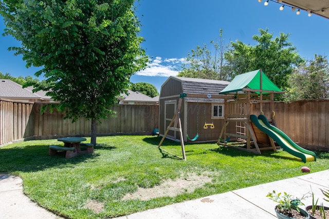 8201 Prosper Dr, Amarillo, TX 79119 - view of playground with a shed and an outdoor structure