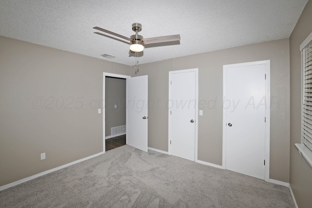 7426 Jameson Dr, Amarillo, TX 79121 - unfurnished bedroom with carpet, a textured ceiling, and ceiling fan
