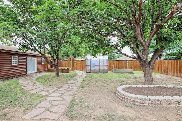 7426 Jameson Dr, Amarillo, TX 79121 - fenced backyard with an outbuilding and an exterior structure