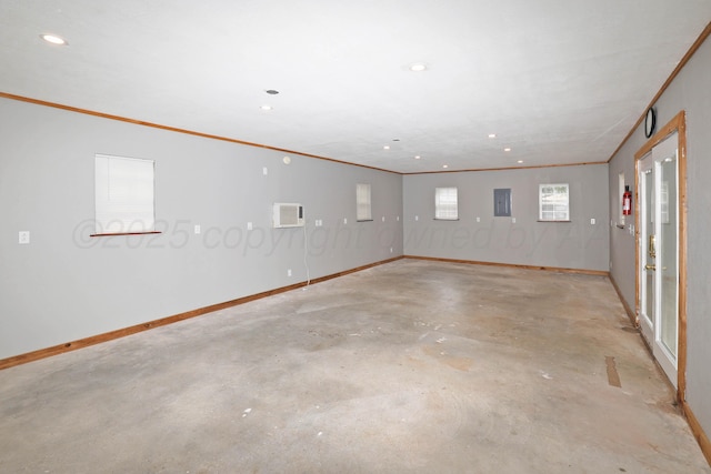7426 Jameson Dr, Amarillo, TX 79121 - empty room with unfinished concrete flooring, ornamental molding, electric panel, recessed lighting, and a wall mounted air conditioner