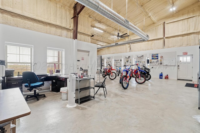 4687 E Fm 1151, Amarillo, TX 79118 - garage with a ceiling fan and an office area