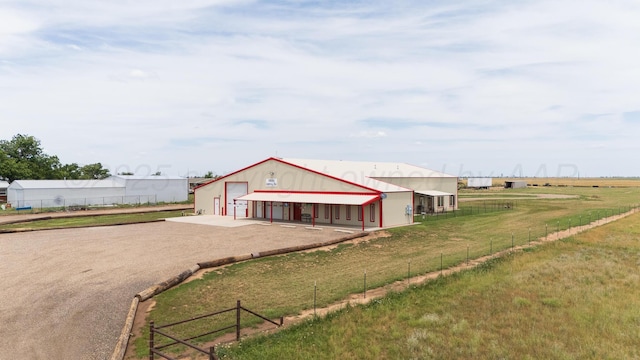 4687 E Fm 1151, Amarillo, TX 79118 - view of front facade with an outbuilding, a pole building, a detached garage, and dirt driveway