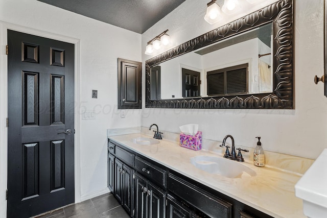 1604 Country Ln, Panhandle, TX 79068 - full bathroom with double vanity, tile patterned floors, and a textured ceiling