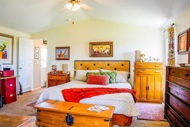 carpeted bedroom featuring ceiling fan and vaulted ceiling