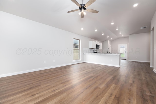 3100 Settler Ave, Amarillo, TX 79124 - unfurnished living room featuring lofted ceiling, recessed lighting, ceiling fan, and dark wood-style flooring